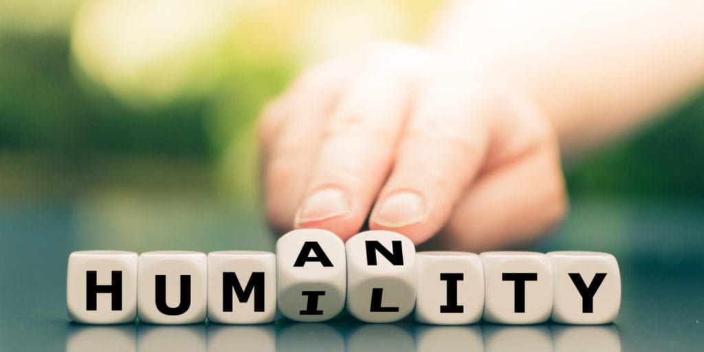 Dice Form The Words "humility" And "humanity".