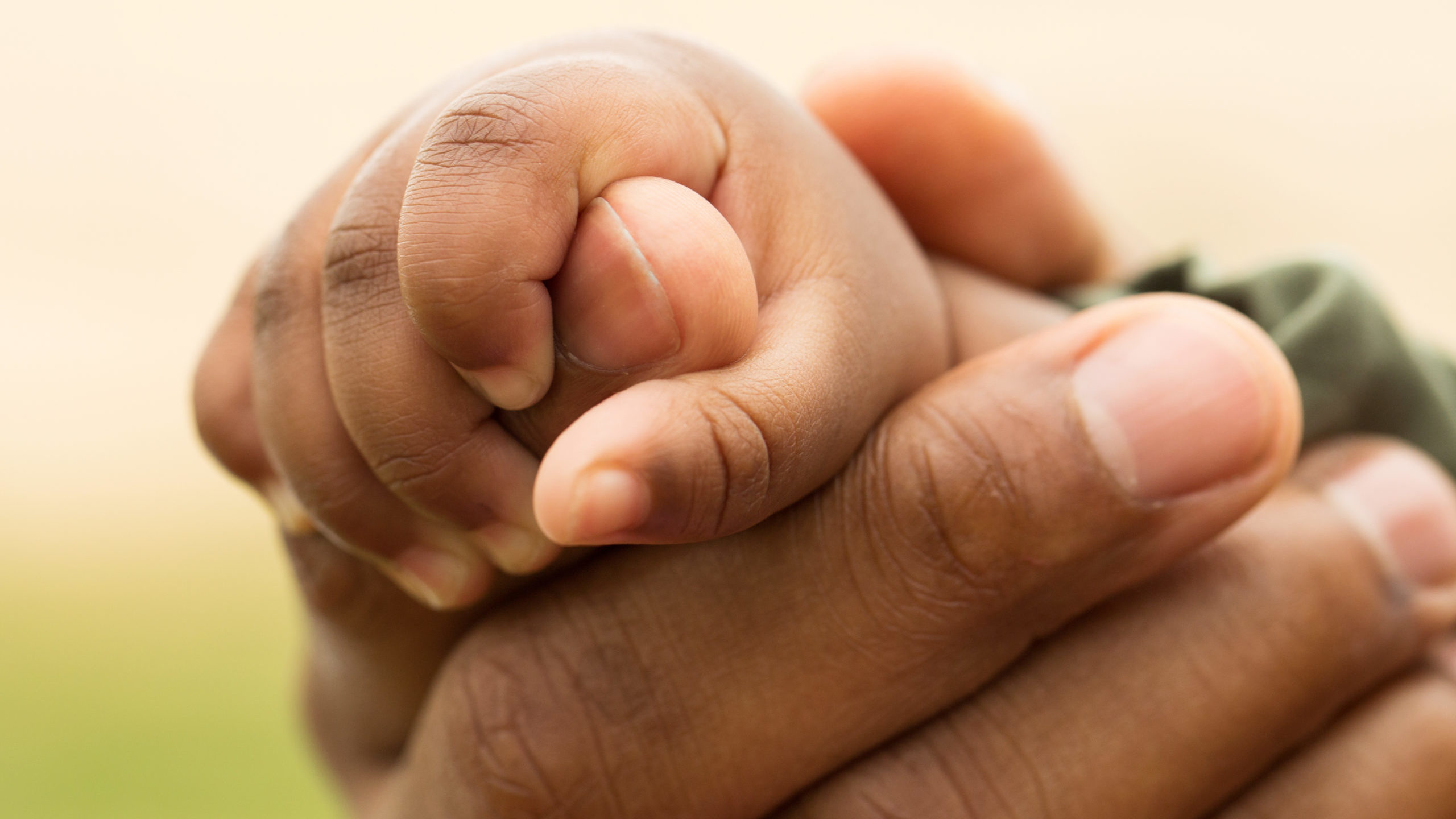 Concept Of Love And Family. Hands Of Mother And Baby Closeup.