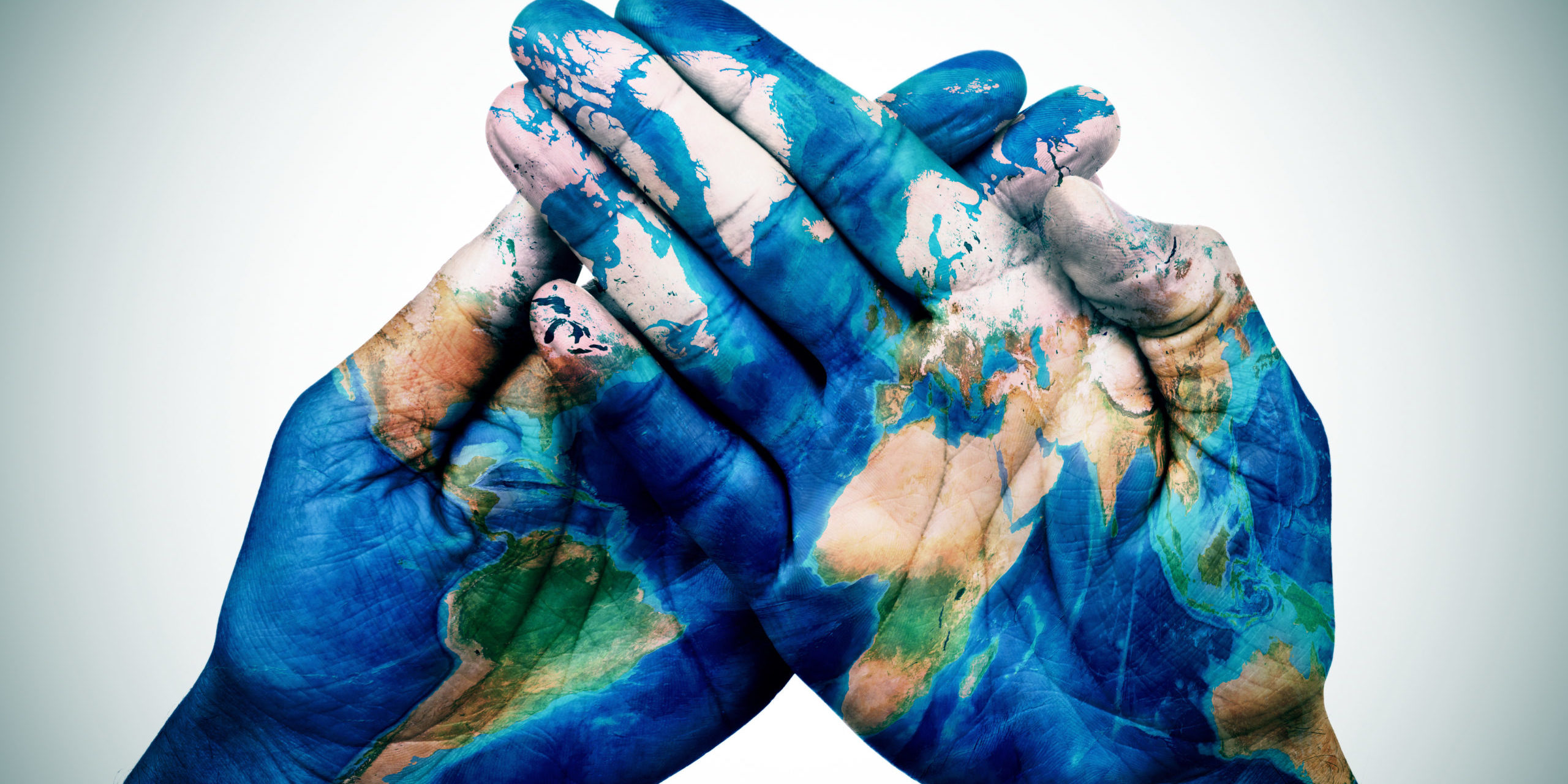 Man Hands Patterned With A World Map (furnished By NASA)